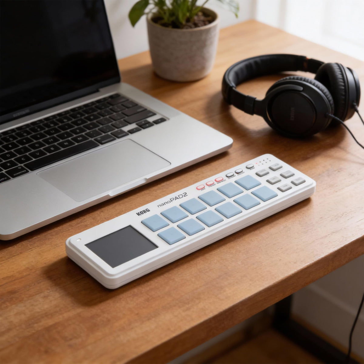 Korg nanoPAD2 Slim-Line USB Controller - White w/ Headphones